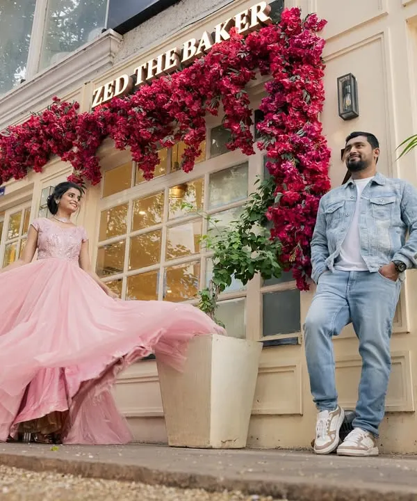A fairytale moment captured on a city street. I love creating these playful, dynamic shots that show a couple's joyful energy, with her pink gown adding a perfect splash of cinematic color against the urban backdrop.