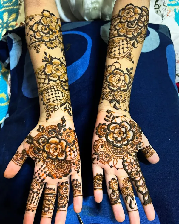 Even little hands can have intricate designs. This beautiful floral pattern was done on a 7-year-old, showing that my detailed work can be adapted for smaller hands.