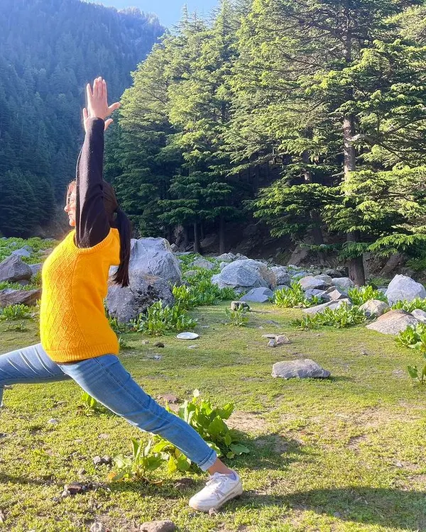 Yoga is a science of well-being, youthfulness, and integrating body, mind, and soul. Here I am practicing a high lunge, feeling the connection with the earth and sky.