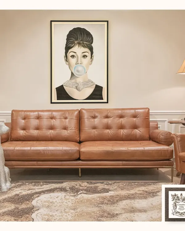 This iconic Audrey Hepburn print adds a touch of playful chic to a modern living room. Paired with a classic mid-century leather sofa, it creates a stylish, eclectic look that bridges timeless glamour and contemporary design.