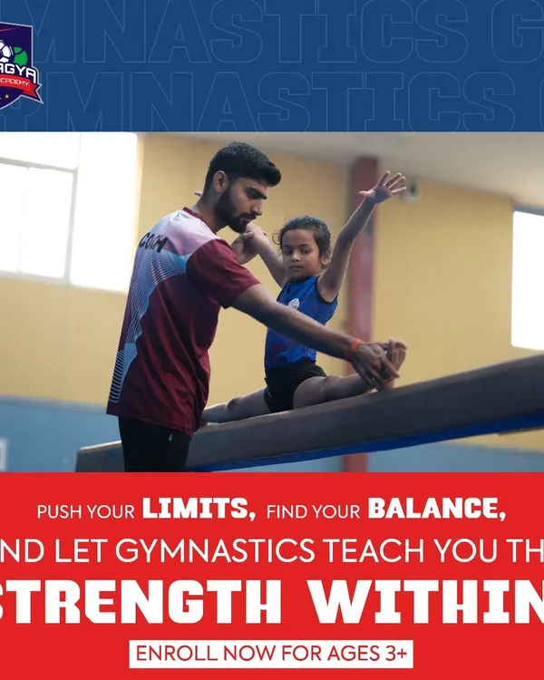 A coach carefully assists a young gymnast on the balance beam, helping her find her balance and strength. This image captures our commitment to providing personalized guidance and ensuring safety for children as young as three.