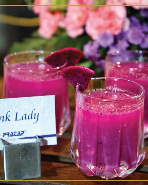 Sip into something fabulous with our "Pink Lady" mocktail. This vibrant dragon fruit drink is a delightful blend of elegance and flavor, perfect for welcoming your guests.