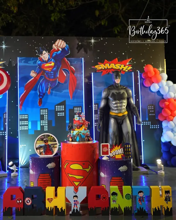 We created a power-packed superhero bash with life-sized statues of Superman and Batman. The setup included a city-at-night backdrop and custom-themed pedestals, perfect for a young hero's celebration.