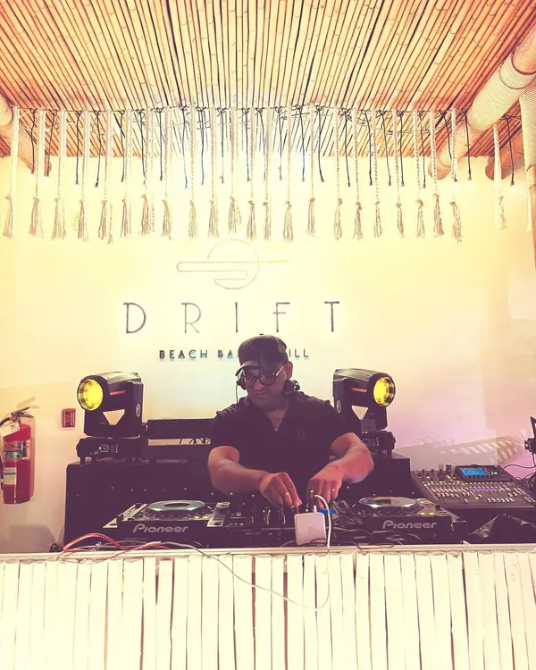 On the decks at Drift Beach Bar & Grill in Thailand for a wedding event. This shot highlights my experience playing at premier international venues and adapting my sound to fit a tropical, upscale vibe.