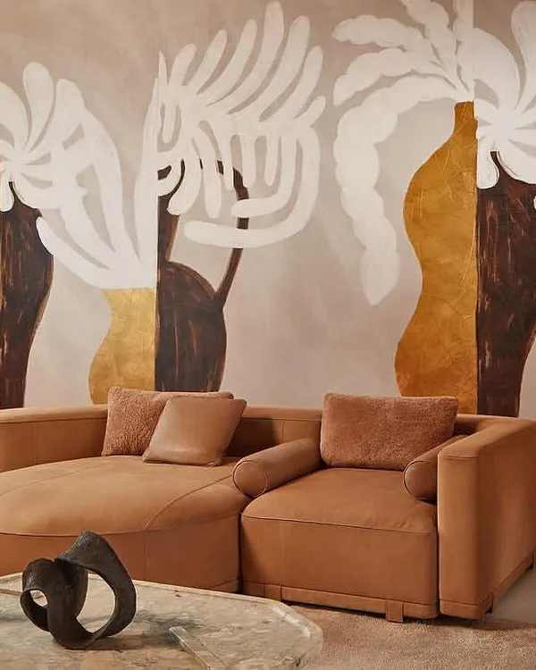 We see walls as a canvas for breathtaking art. This living space is transformed by a Kintsugi-inspired mural, where abstract forms and metallic leafing create a statement of serene elegance and modern luxury.