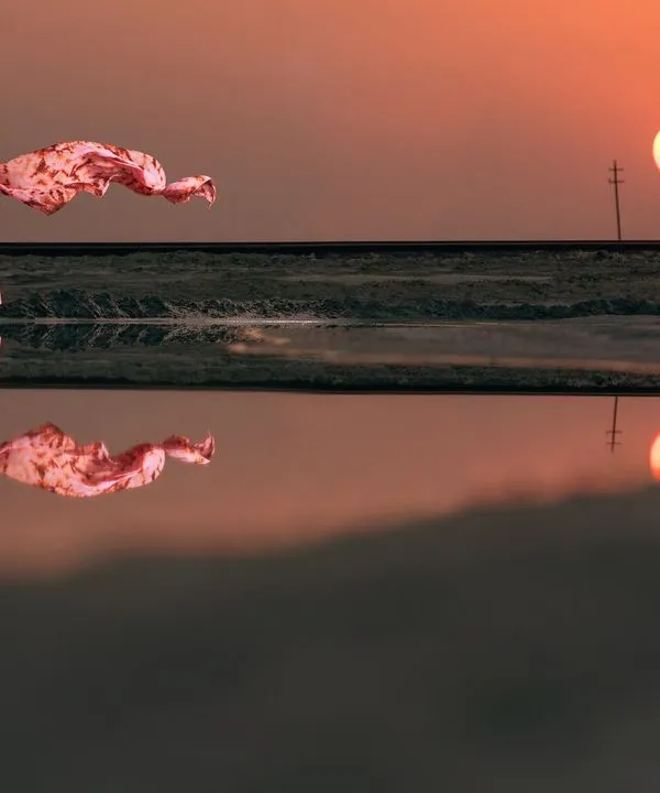 A quiet moment at sunset, reflected in the water like a painting. I love creating these timeless, artistic portraits that are all about your connection.