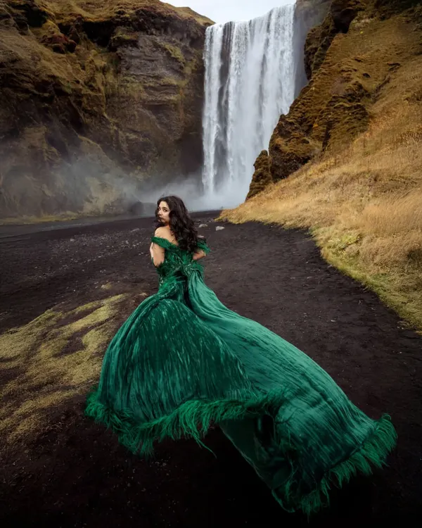 A closer look at the incredible detail and movement of this Gavin Miguel gown. The flowing train and rich emerald color created such a powerful contrast against Iceland's black sand and waterfalls. This is what photoshoot dreams are made of.