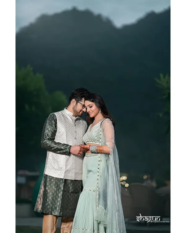 In your arms, I've found my safe haven. A tender moment between the couple during their pre-wedding shoot in the serene hills of Rishikesh.
