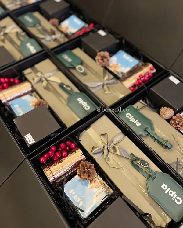 A sophisticated gift hamper curated for international delegates at Cipla. It features custom-branded luggage tags and other items that celebrate Indian craftsmanship, making it a memorable gift for global partners.