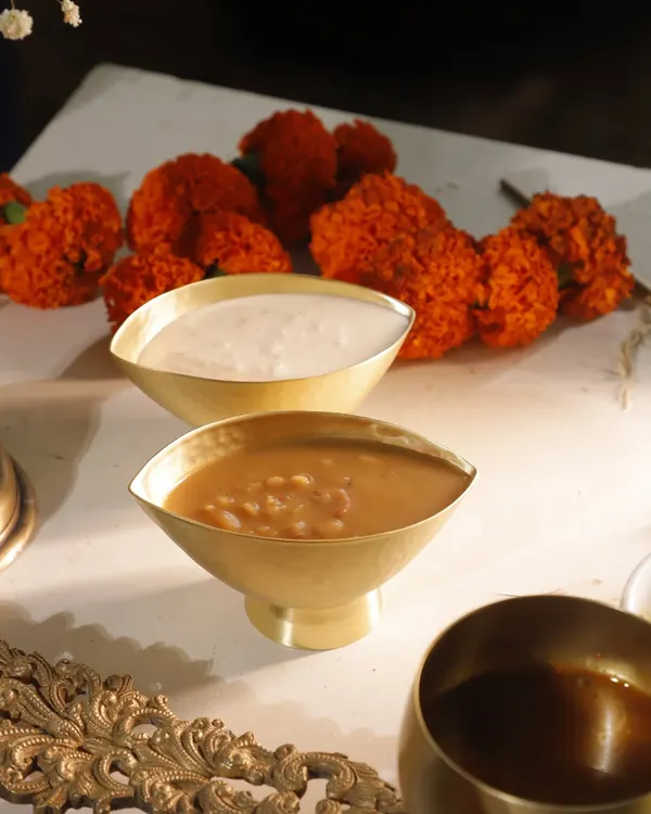 Ada and Palada, the two sweet crowns of any Sadya. Served in traditional brass bowls, these payasams represent the final, blissful bites of the feast. One is jaggery-based, the other milk-based, but both are divine.