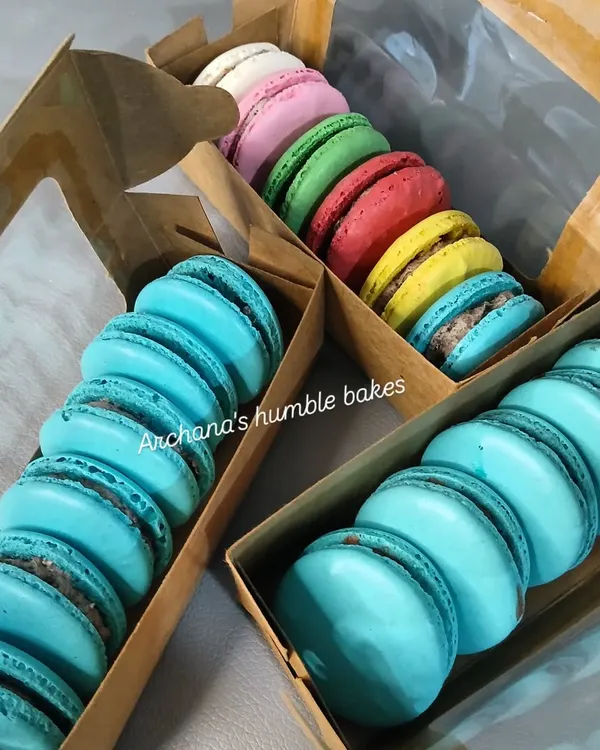 Life is sweet, and my eggless macarons make it even sweeter. This image shows a variety of colorful macarons, perfectly baked with crisp shells and chewy centers, packed in gift boxes.
