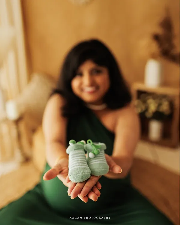The tiniest shoes, waiting for the tiniest feet. This is a classic detail shot that speaks volumes about the love and anticipation you feel.