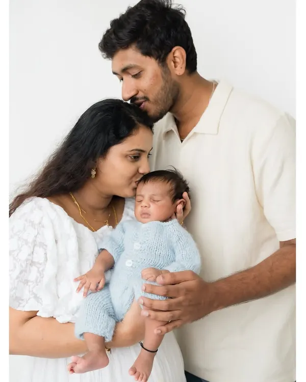 The first family portrait. I love capturing the complete family unit, with both parents showering their new baby with love and affection.