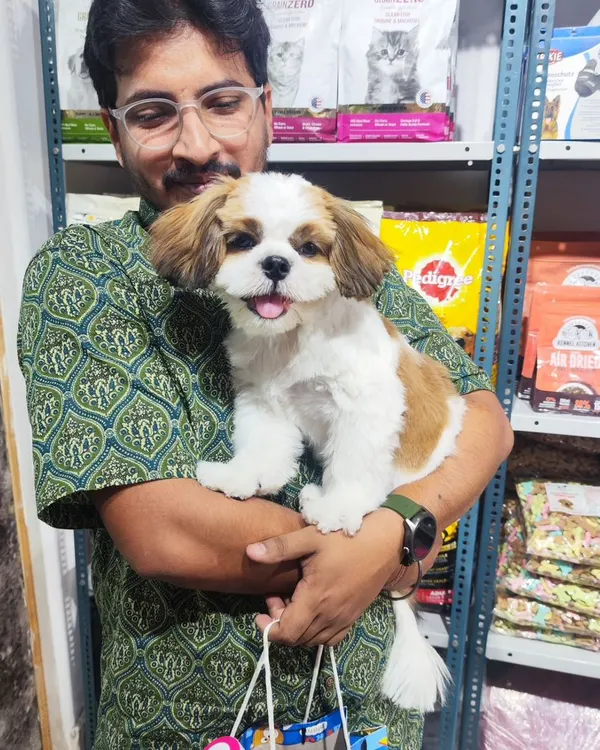 This is what it's all about, a happy, freshly groomed pup and his equally happy parent. We are surrounded by all the best pet supplies, from food to grooming products, ready for you.