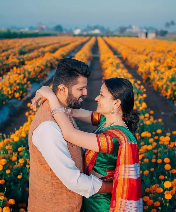 This is what pure joy looks like, surrounded by a field of marigolds. I love finding unique, natural backdrops for pre-wedding shoots that reflect the couple's vibrant spirit. This traditional Marathi couple shoot was all about capturing their connection in a setting full of color and life.