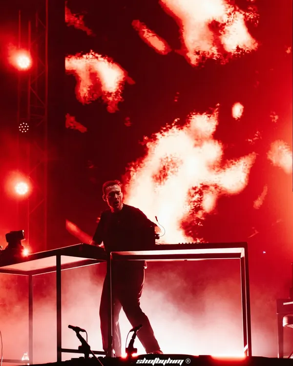 Ben Böhmer performs in a haze of red smoke and light, creating a fiery and intense atmosphere for his melodic techno set.