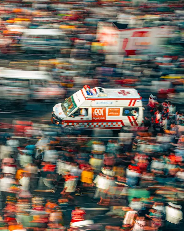 Capturing the chaos and devotion of the Rath Yatra in Puri. This motion blur shot of an ambulance cutting through the crowd tells a powerful story.