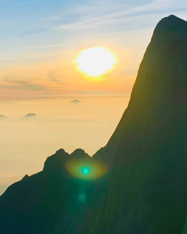 This is the magic we chase. Witnessing a sunrise from Kolukkumalai, the world's highest tea plantation, is an unforgettable experience on our Munnar backpacking trip.