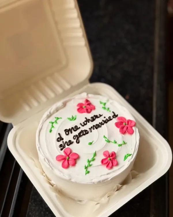 A perfect cake for a "Friends" fan who is getting married! This pretty floral bento cake has the message "d one where she gets married," a sweet nod to the show's episode titles.