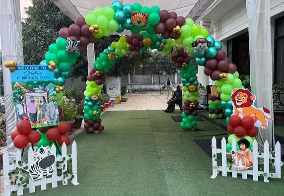 A grand entrance arch for a jungle-themed first birthday party. This video shows the massive balloon arch with animal cutouts, setting an exciting tone right from the start.