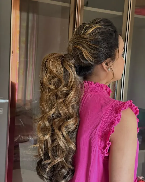 When you want texture and volume, I've got you. This high-impact ponytail was created using my wrap-around extension, featuring beautiful highlights and bouncy curls.