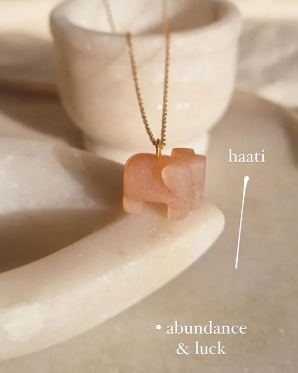 My 'haati' elephant pendant, hand-carved from peach moonstone. This charm is for abundance and luck, and I especially recommend it for those who feel unlucky in love.