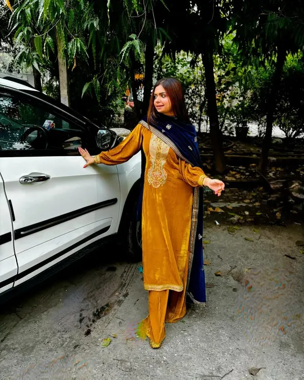 There's nothing like the elegance of a velvet suit in winter. This mustard yellow ethnic ensemble is perfect for festive daytime events, combining traditional embroidery with a rich, modern color.