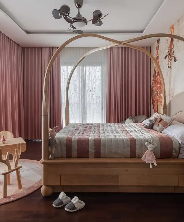 This arched four-poster bed is the heart of a whimsical daughter's room. Crafted from light oak, its graceful curves create a sense of gentle enclosure, making it a magical and comforting space for a child.