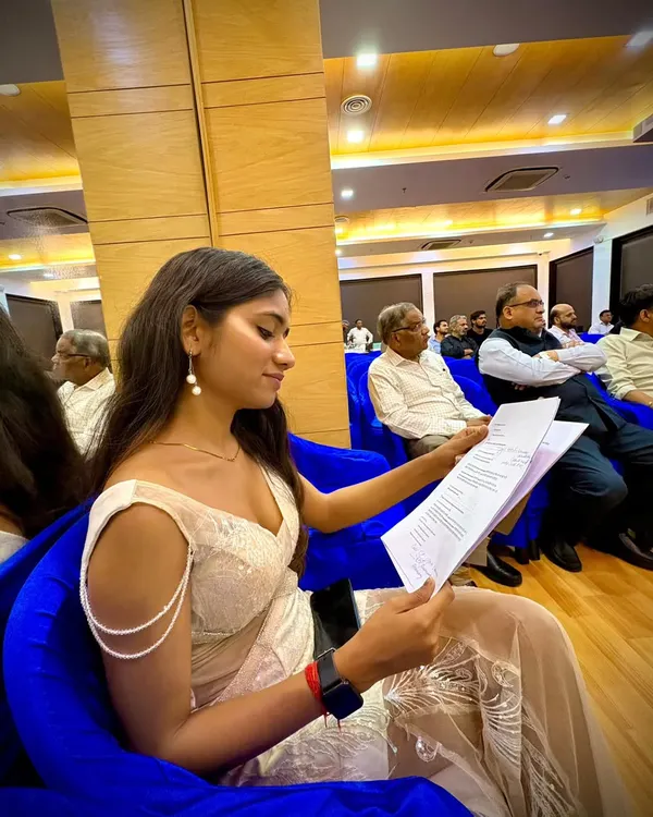 Before the energy and action, there's always a moment of quiet preparation. Here I am reviewing the event flow and my script to ensure everything runs smoothly and professionally.