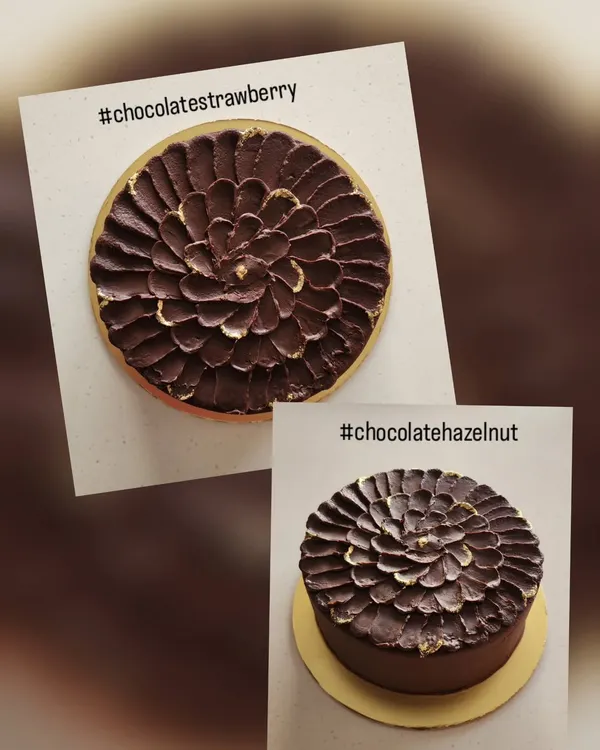 This shows how two cakes can look identical on the outside but have completely different flavors inside. One is a classic chocolate strawberry and the other is a rich chocolate hazelnut, both finished with the same textured ganache.