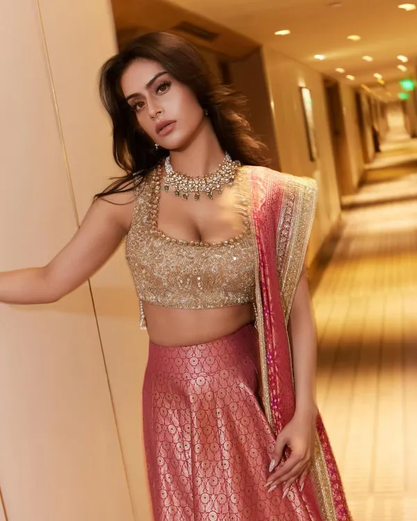 Nysa Devgan looking absolutely stunning in a Manish Malhotra Banarasi brocade lehenga, a perfect choice for a friend's wedding.