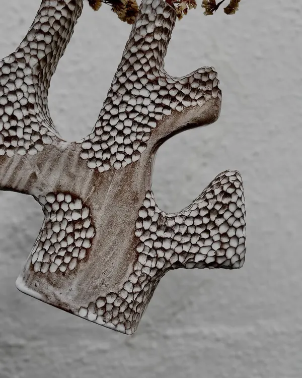 Check out this incredible hand-built vase with a carved honeycomb texture. This piece was made by one of our instructors to showcase different hand-building techniques.