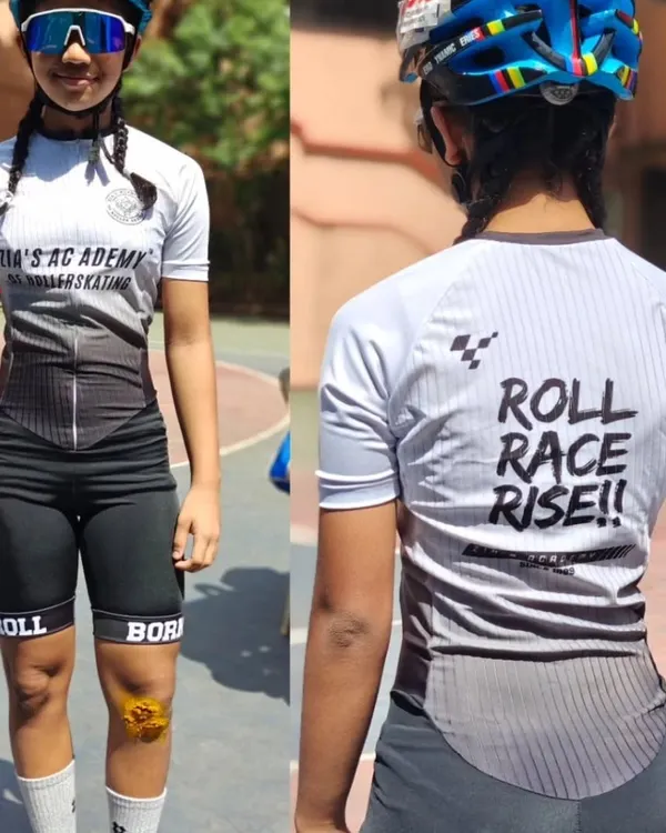 Our new academy body suit, seen from the front and back. The "Roll, Race, Rise" motto on the back is what we're all about.