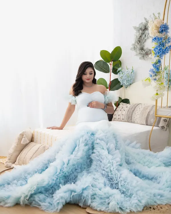 This is the essence of my work: capturing the quiet strength and serene beauty of motherhood. This portrait, with the soft light and the cascading tulle of the gown, creates a dreamy, ethereal atmosphere that turns a fleeting moment into a timeless piece of fine art.