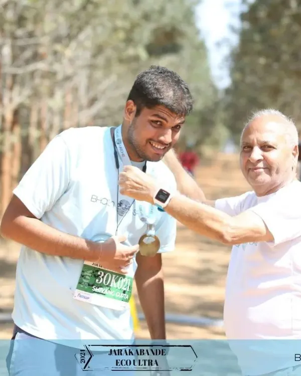 A moment of pure pride. Our founder, Sushil Bhasin, personally awards a finisher's medal at the Jarakabande Eco Ultra. We believe in celebrating every runner's accomplishment.