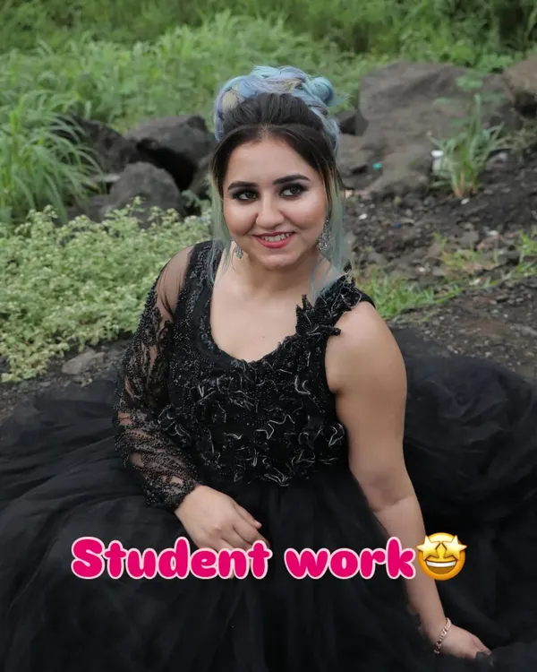 A stunning party look created by one of my students. They've combined a classic smokey eye with a modern, colorful hairstyle. The "Student Work" sticker shows our pride in their skills.
