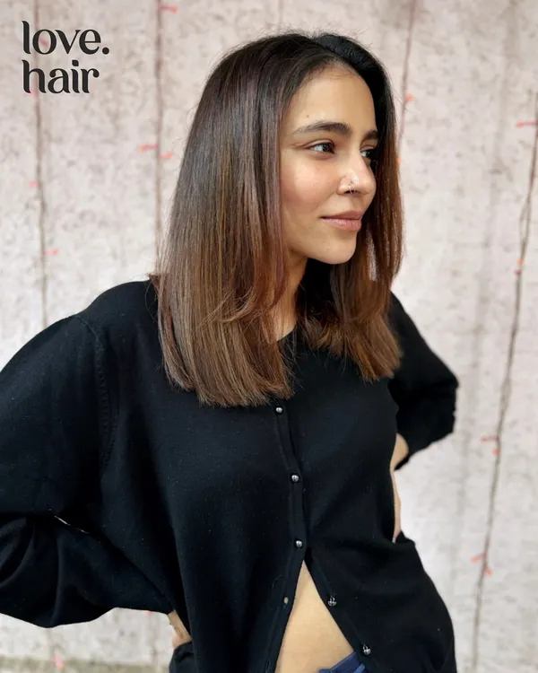 Lux brunettes in a chic, shoulder-length cut. This style is timeless and sophisticated, with subtle layers to add movement and a healthy, straight finish.