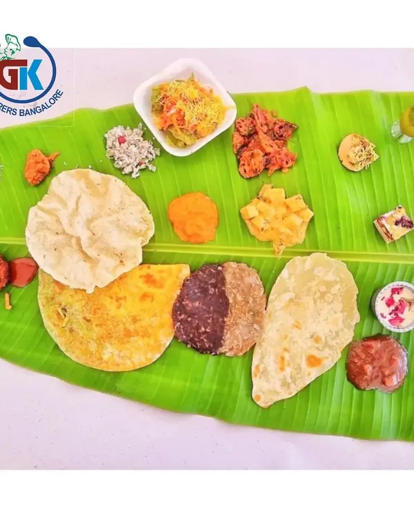 The Famous 50-50 Holige: Our signature fusion sweet. This holige (obbattu) is half traditional dal filling and half rich chocolate, offering two amazing tastes in one. It's a must-try.