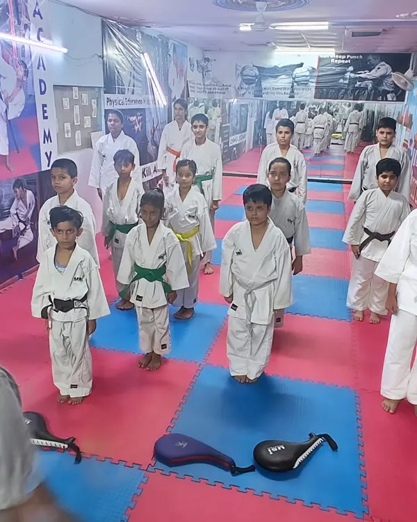 Students standing in formation during a class at the Open National Karate Championships, showing the discipline we instill.
