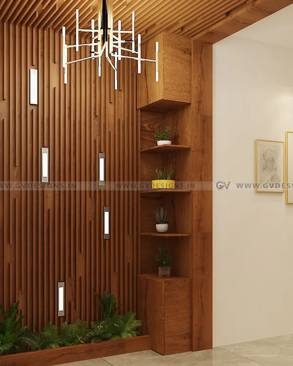 We transformed this foyer into a warm and inviting entrance using polished wooden rafters. The design includes integrated wall lights, a corner display shelf for plants, and a dramatic modern chandelier.