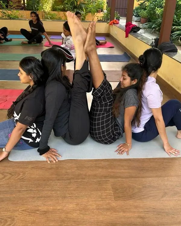 This partner pose is a fun and supportive way to practice a seated forward bend and a backbend simultaneously. It encourages communication and helps both partners achieve a deeper stretch.