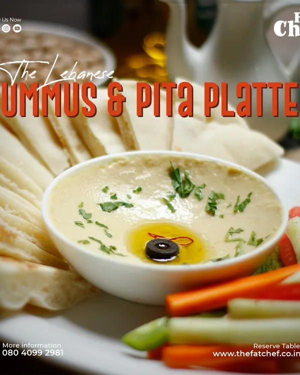 The star of any platter: my Lebanese Hummus & Pita. This is my personal recipe for authentic, smooth hummus, finished with a generous drizzle of good olive oil. It's simple, healthy, and always a crowd-pleaser.