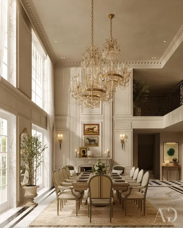 A full view of a majestic, double-height dining room. The soaring ceilings, grand fireplace, and twin crystal chandeliers create an unforgettable sense of scale, perfect for hosting grand dinners while surrounded by timeless beauty.