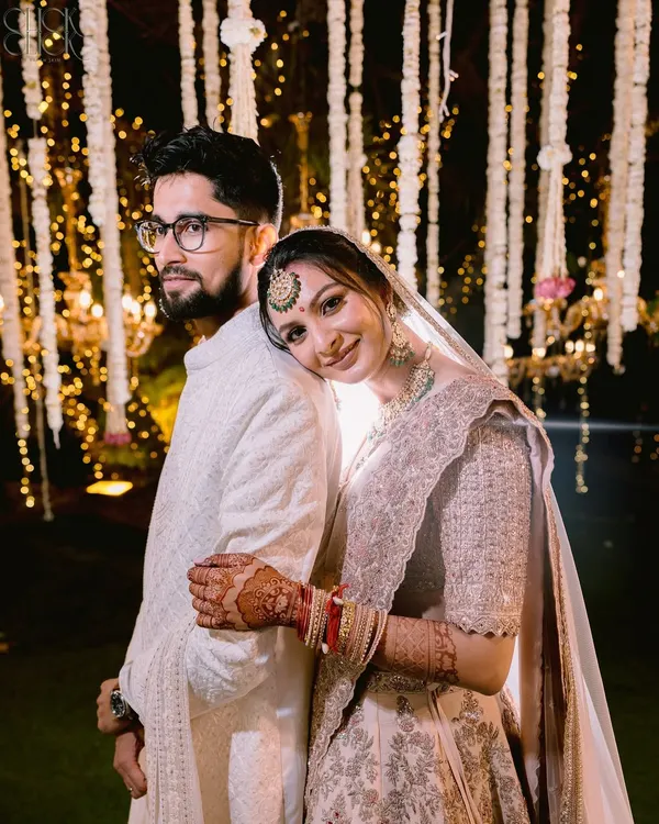 A quiet moment of connection amidst the grand celebration. For Sachi and Aayush, we created a space for them to just be together, resulting in this timeless and elegant portrait that feels as serene as their bond.