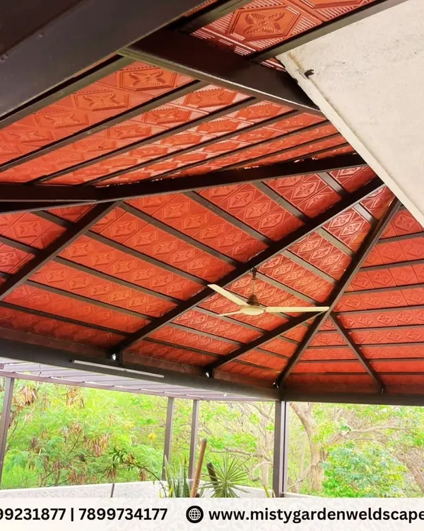 The intricate structure of a custom-designed pergola roof. This design uses patterned tiles for a traditional look, supported by a heavy-duty metal frame to ensure durability and longevity.