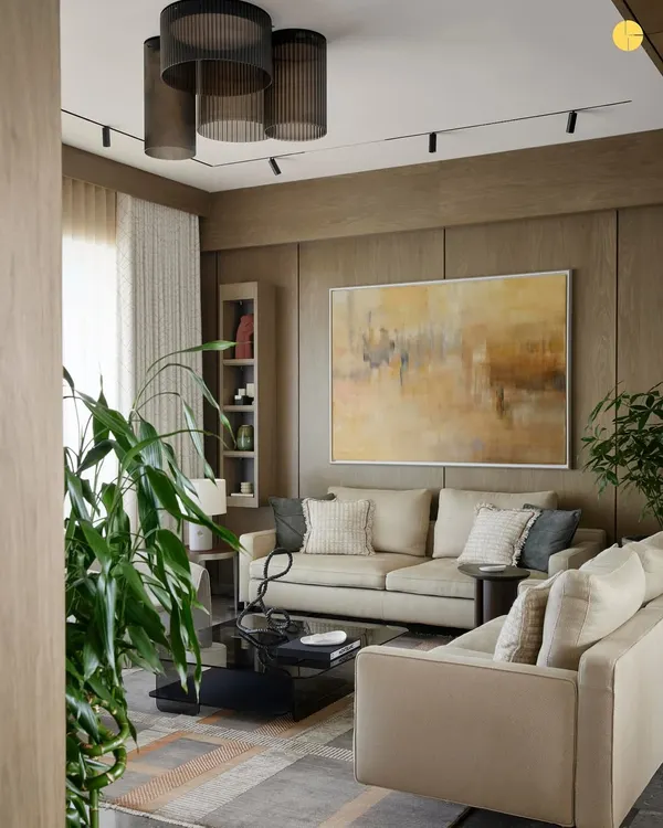 Welcome to 'Pad by the Bay,' a 2,500 sq. ft. home on the Prabhadevi coastline. The living room, wrapped in warm oak veneer, is designed as a space of stillness and light, where curated furniture and art create a dialogue between form and function.