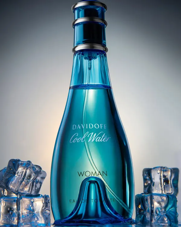 A low-angle shot of the iconic Davidoff Cool Water perfume. I used a dark, moody lighting setup with ice cubes to emphasize the "cool" aspect and give the bottle a grand, heroic presence.