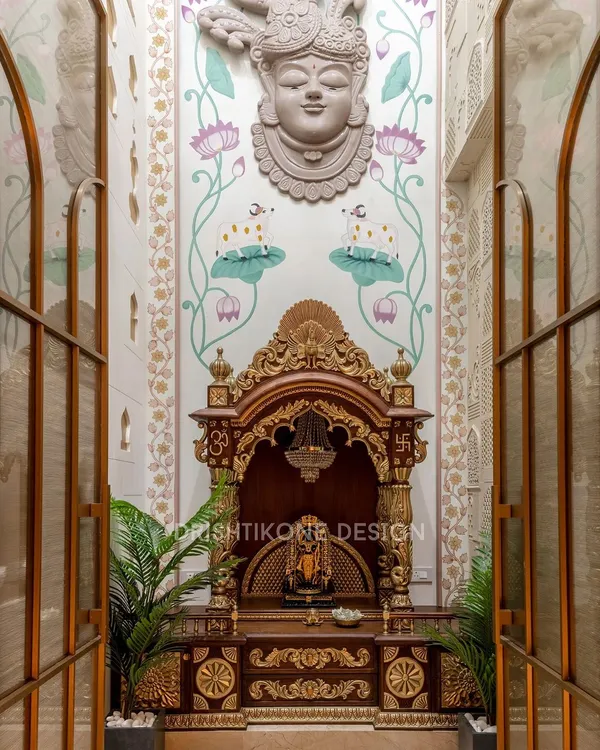 This double-height mandir is the spiritual anchor of the home. We designed it as a grand sanctuary, using a traditional wooden temple, gold-leaf accents, and a hand-painted Shrinath Ji mural to create a space that is both visually stunning and energetically powerful.