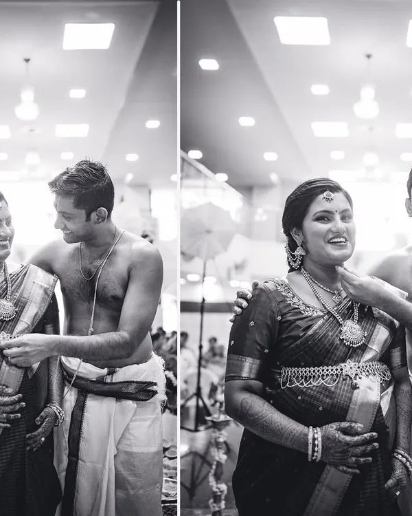 A happy, candid moment between an expecting couple during their baby shower ceremony. We love capturing these genuine smiles in timeless black and white.
