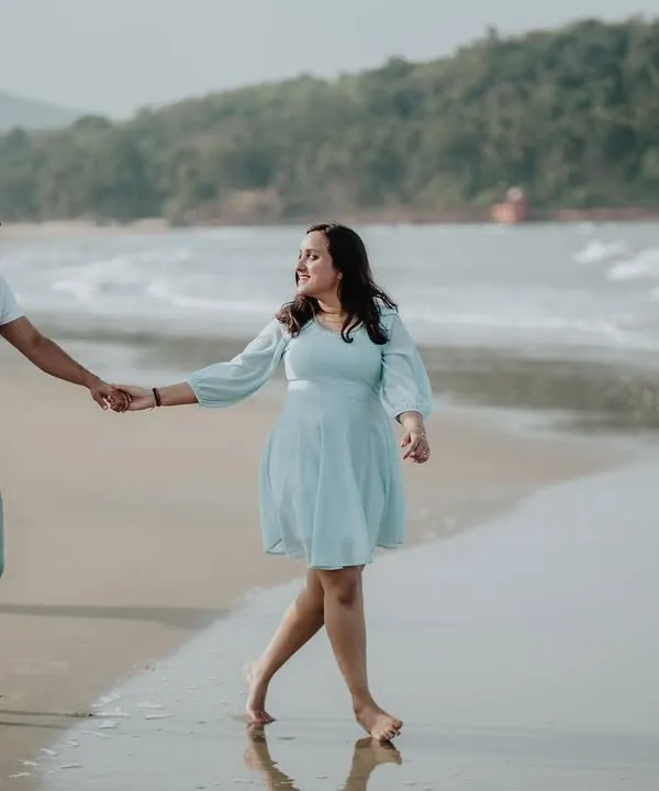 A classic romantic walk along the shoreline. I guide couples into natural poses that feel comfortable and look beautiful on camera.
